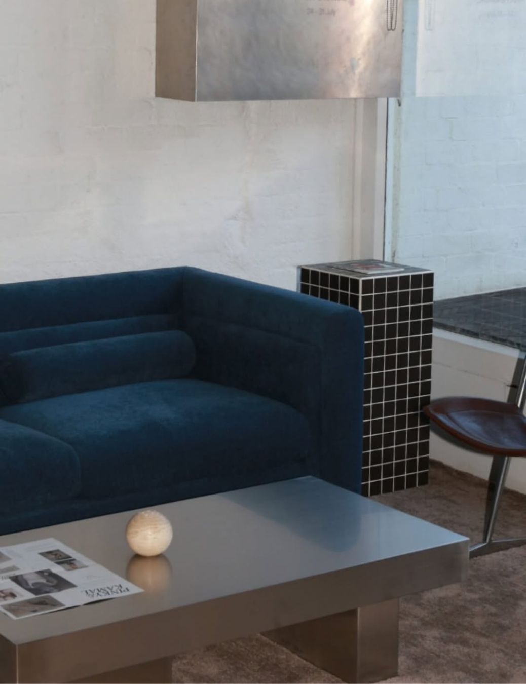 Styled living room with stainless steel coffee table