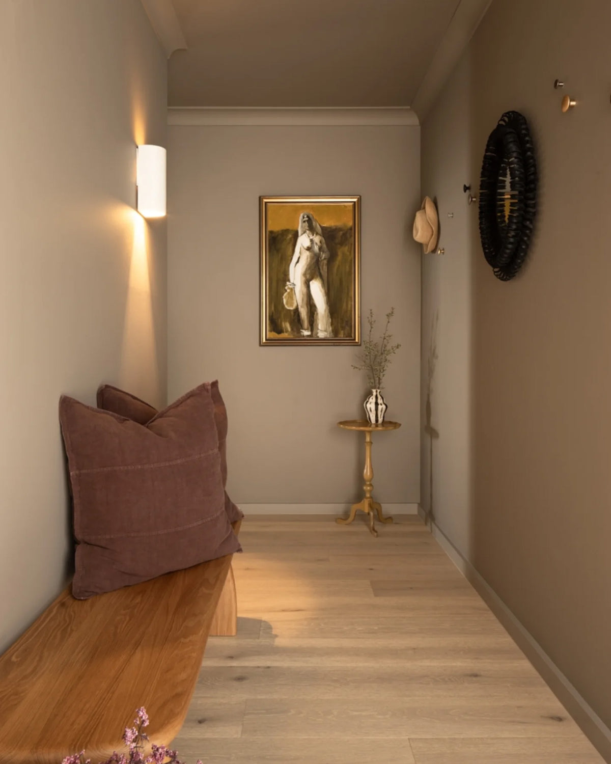 Oak bench seat styled in an entryway