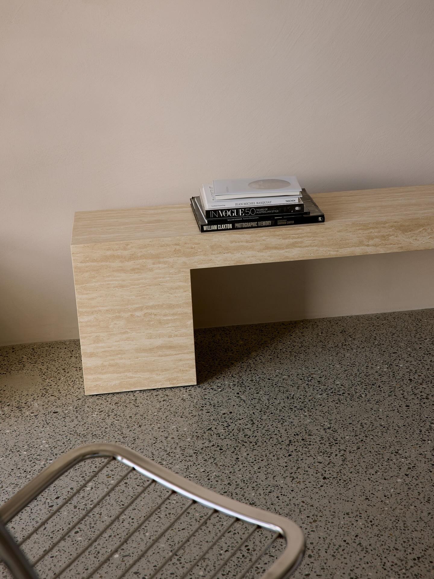 Low console table in cream travertine