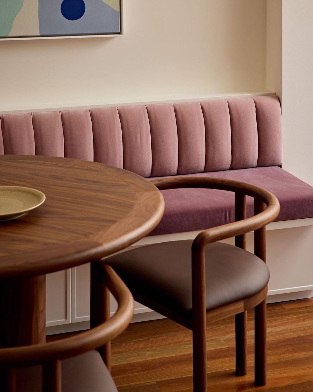 Walnut timber dining chair in a dining room.