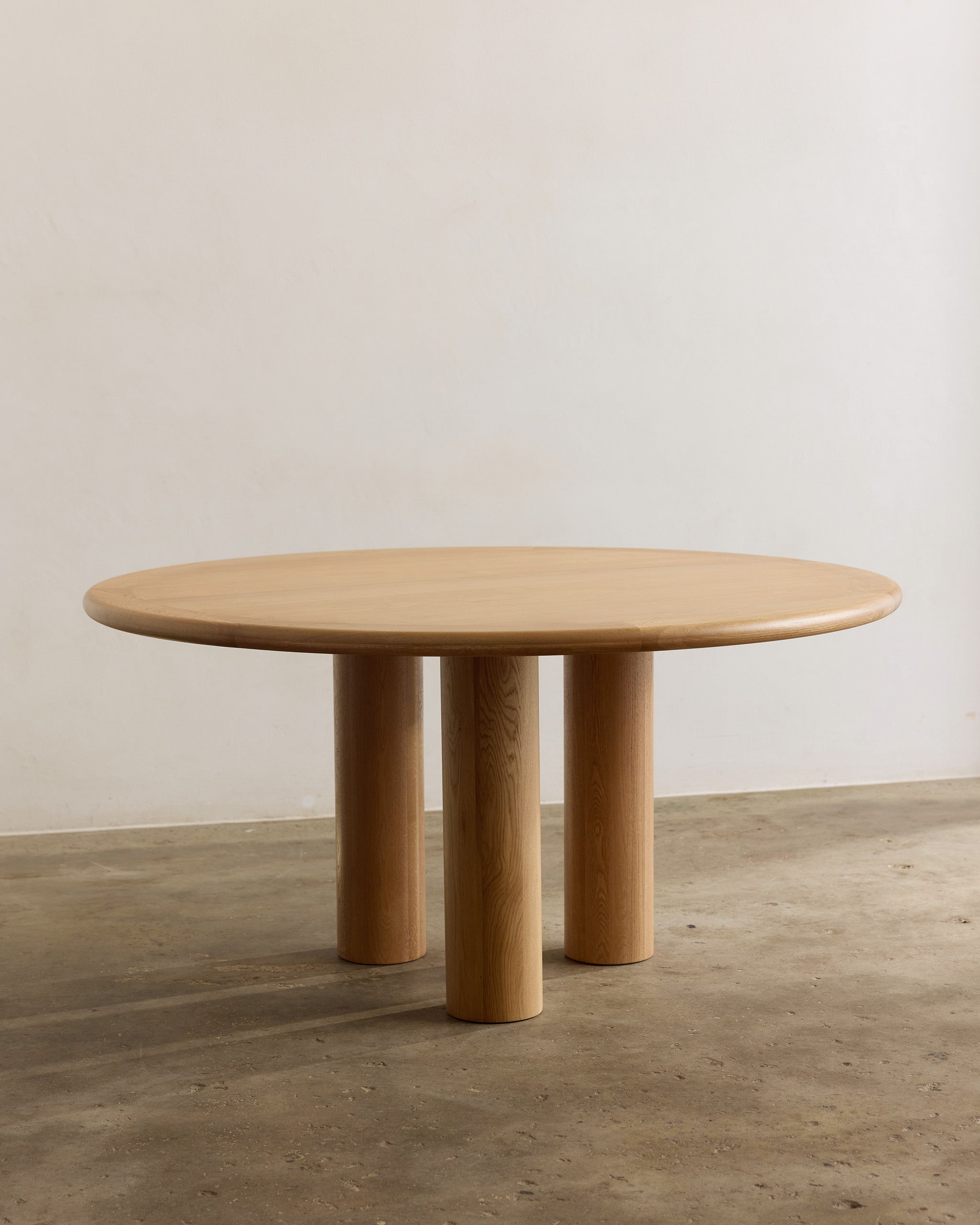 Round oak timber dining table