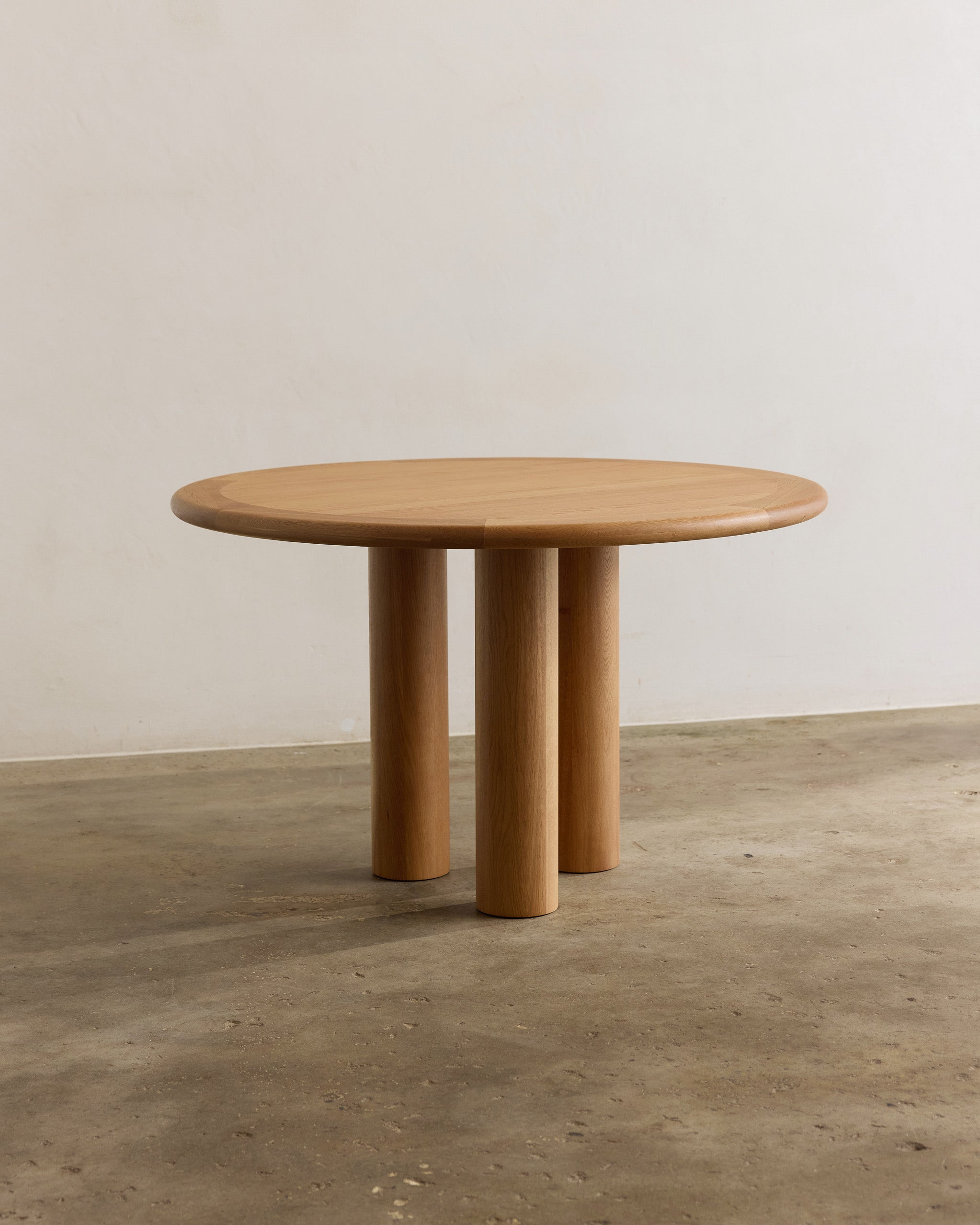 Round oak timber dining table