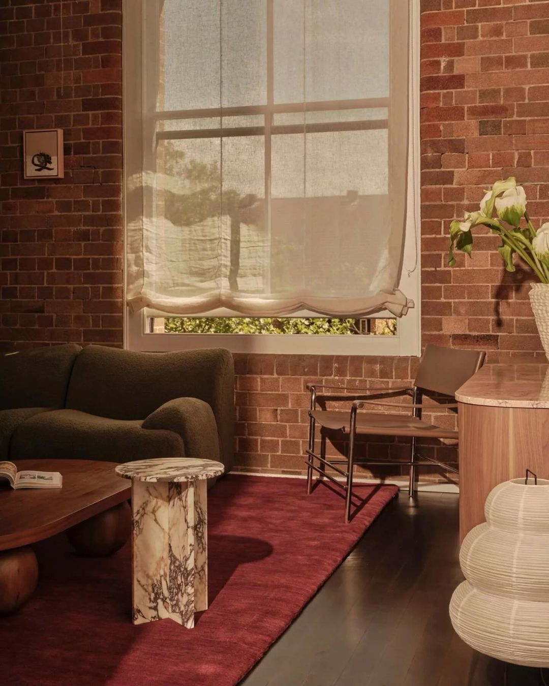 Small calacatta viola side table styled in a living room