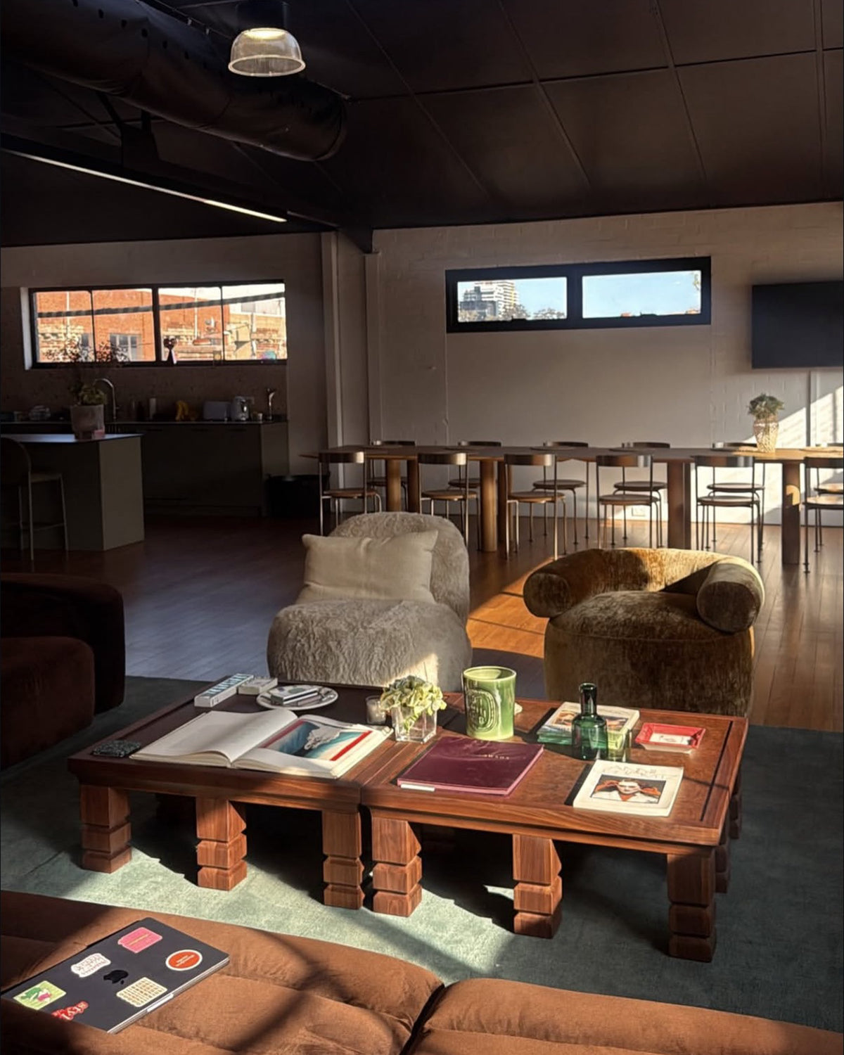 A styled lounge with wooden coffee tables
