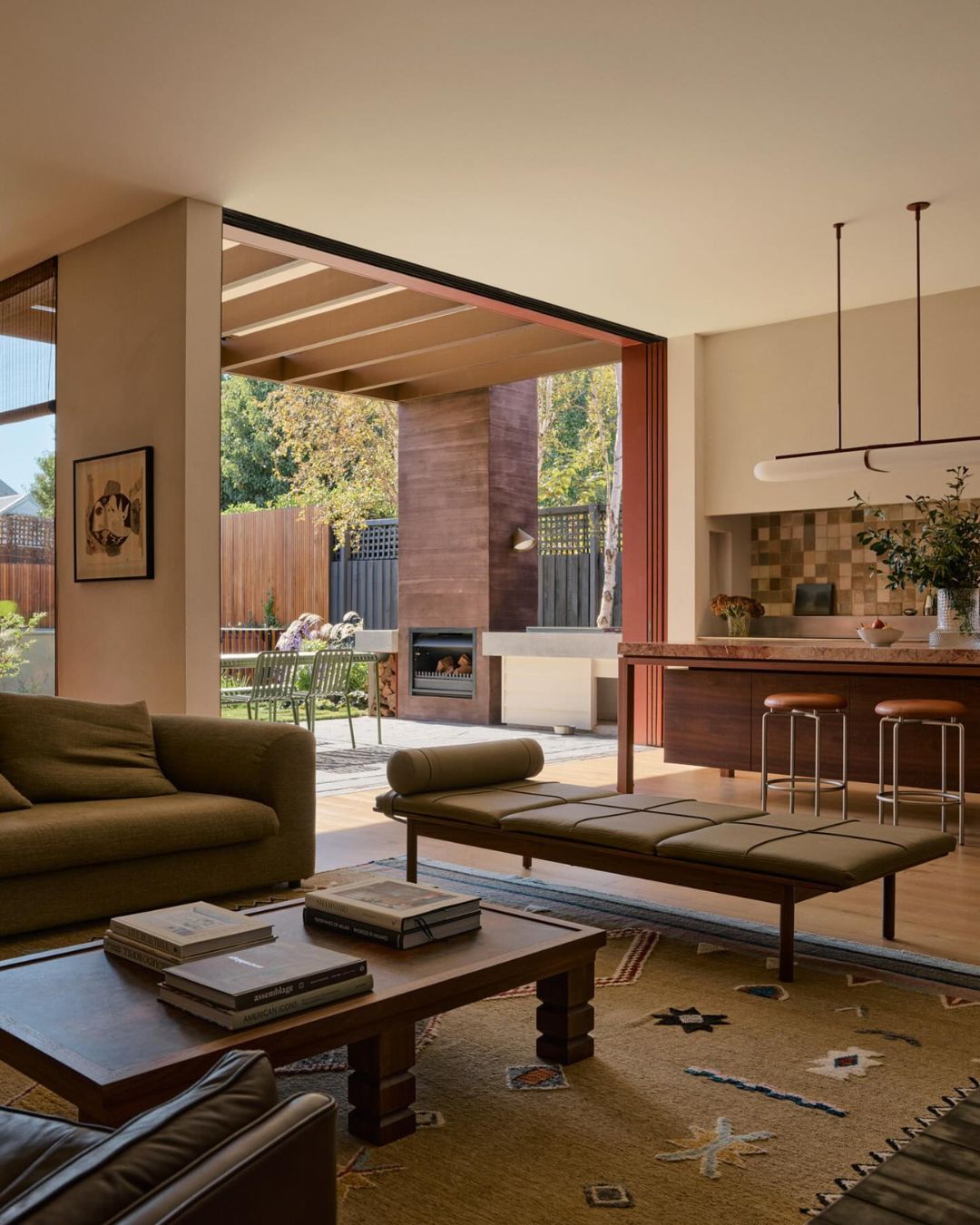 Modern living room with a view of an outdoor patio area.
