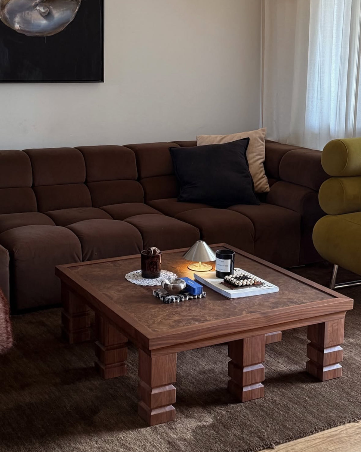 Wooden coffee table styled in a living room