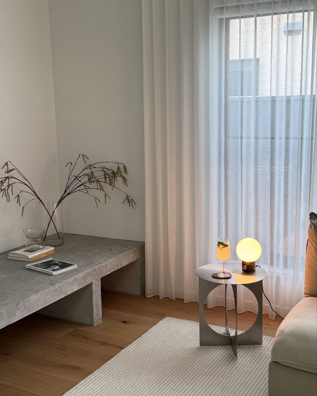 Stainless steel side table styled in a living room