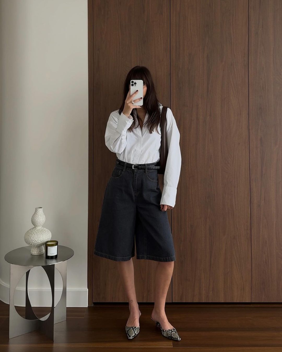 Stainless steel side table in a mirror selfie