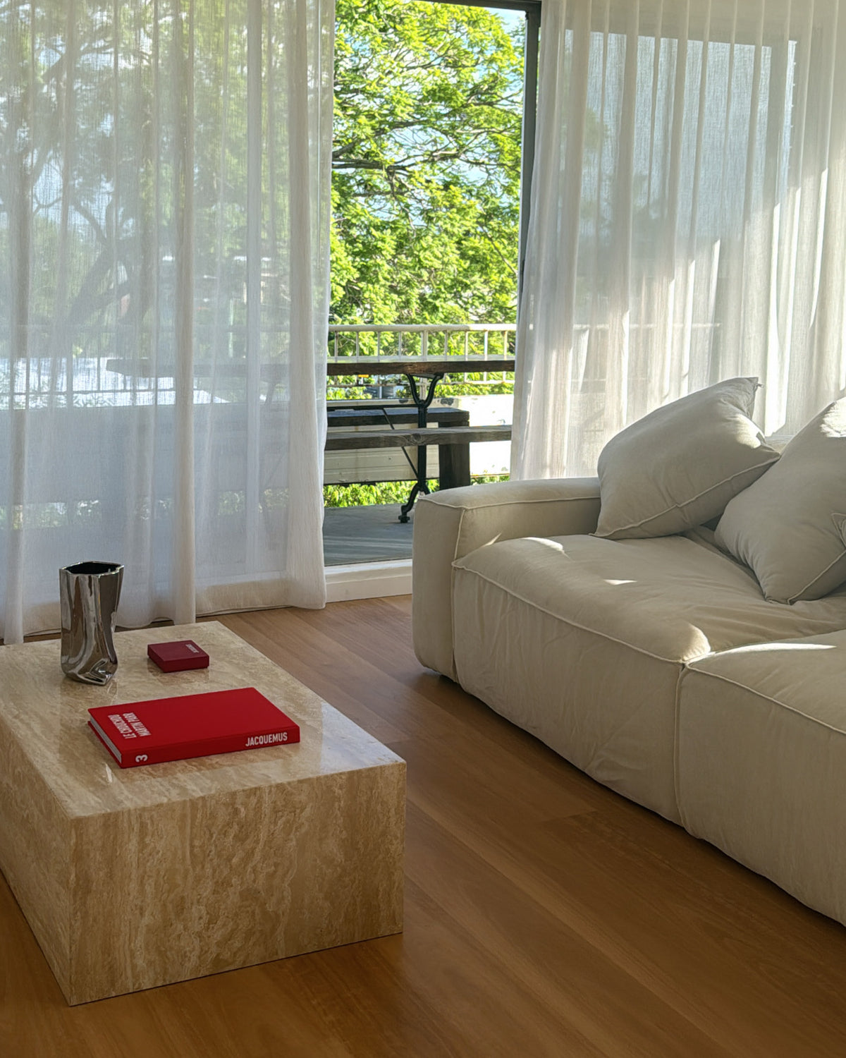 Living room styled with a cream travertine coffee table