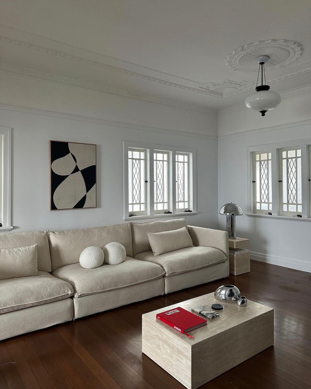 Living room styled with a cream travertine coffee table