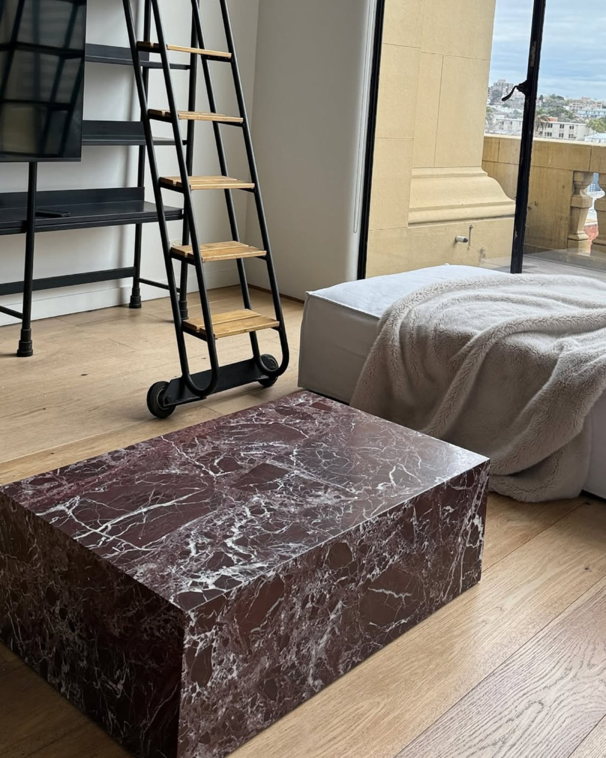 Rosa levanto plinth coffee table styled in a living room