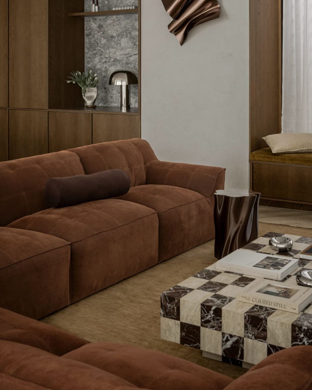 Checkerboard marble coffee table styled in a living room