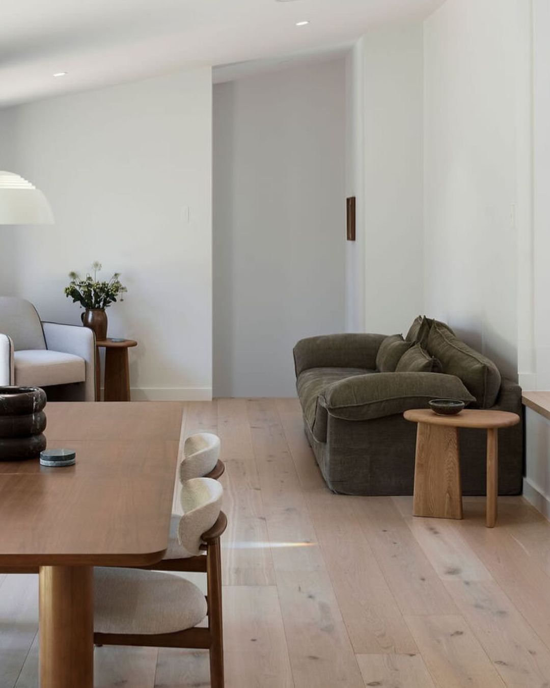 Small oak timber side table styled in a living room