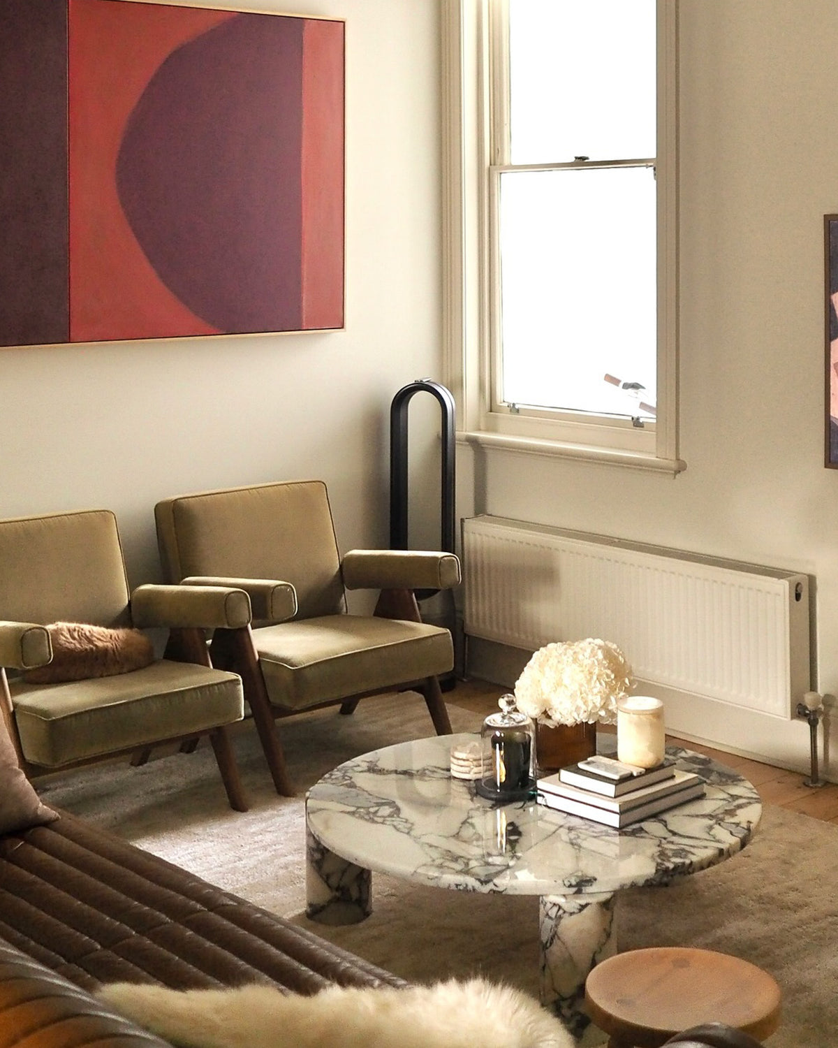 Marble coffee table styled in a living room.