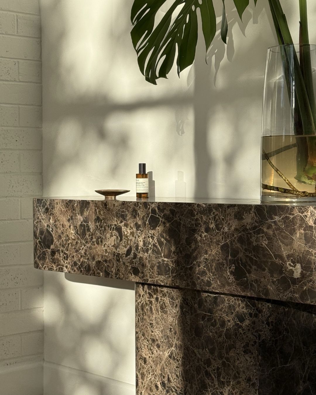 Chocolate marble console table styled