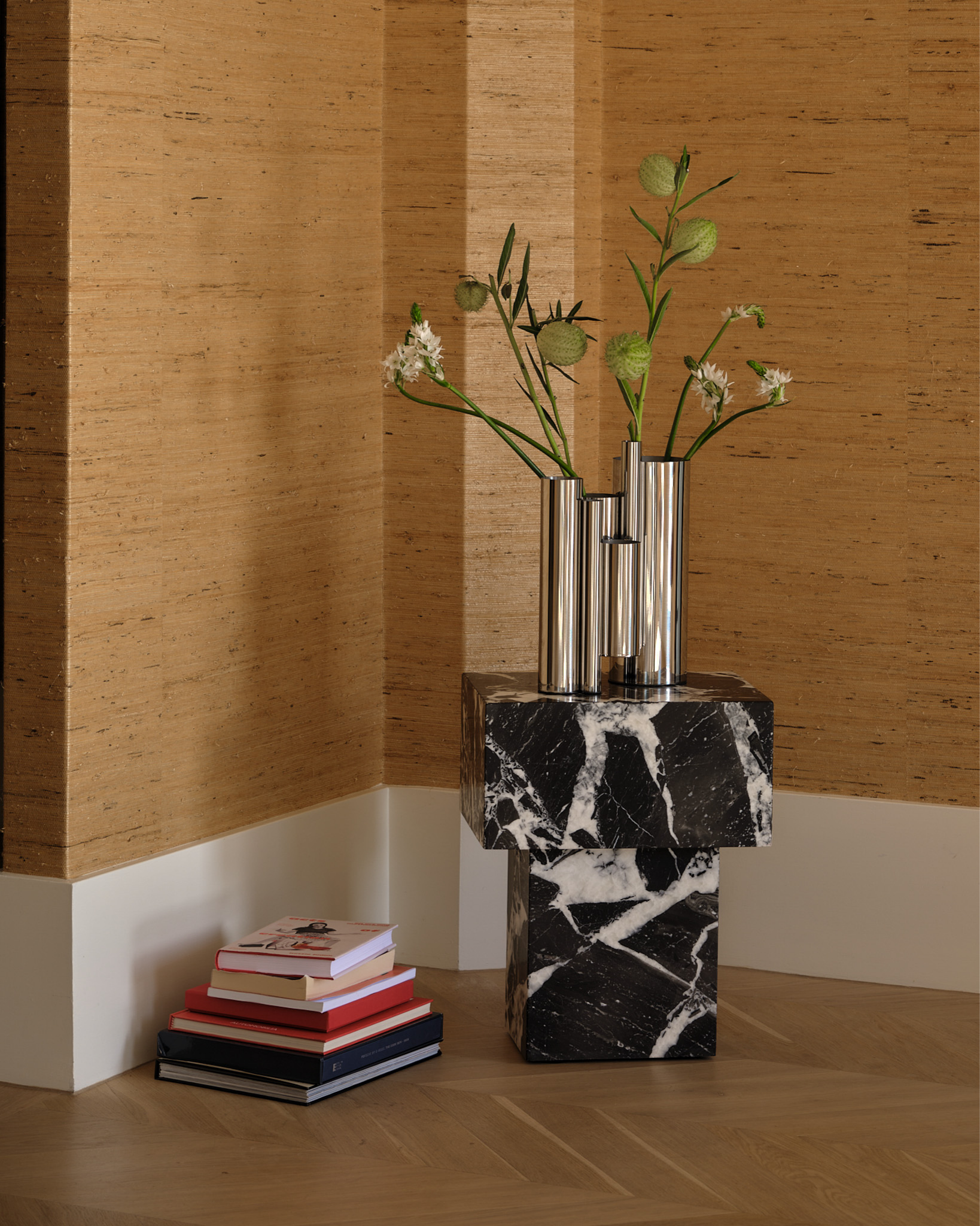 Marble side table styled with a stainless steel vase