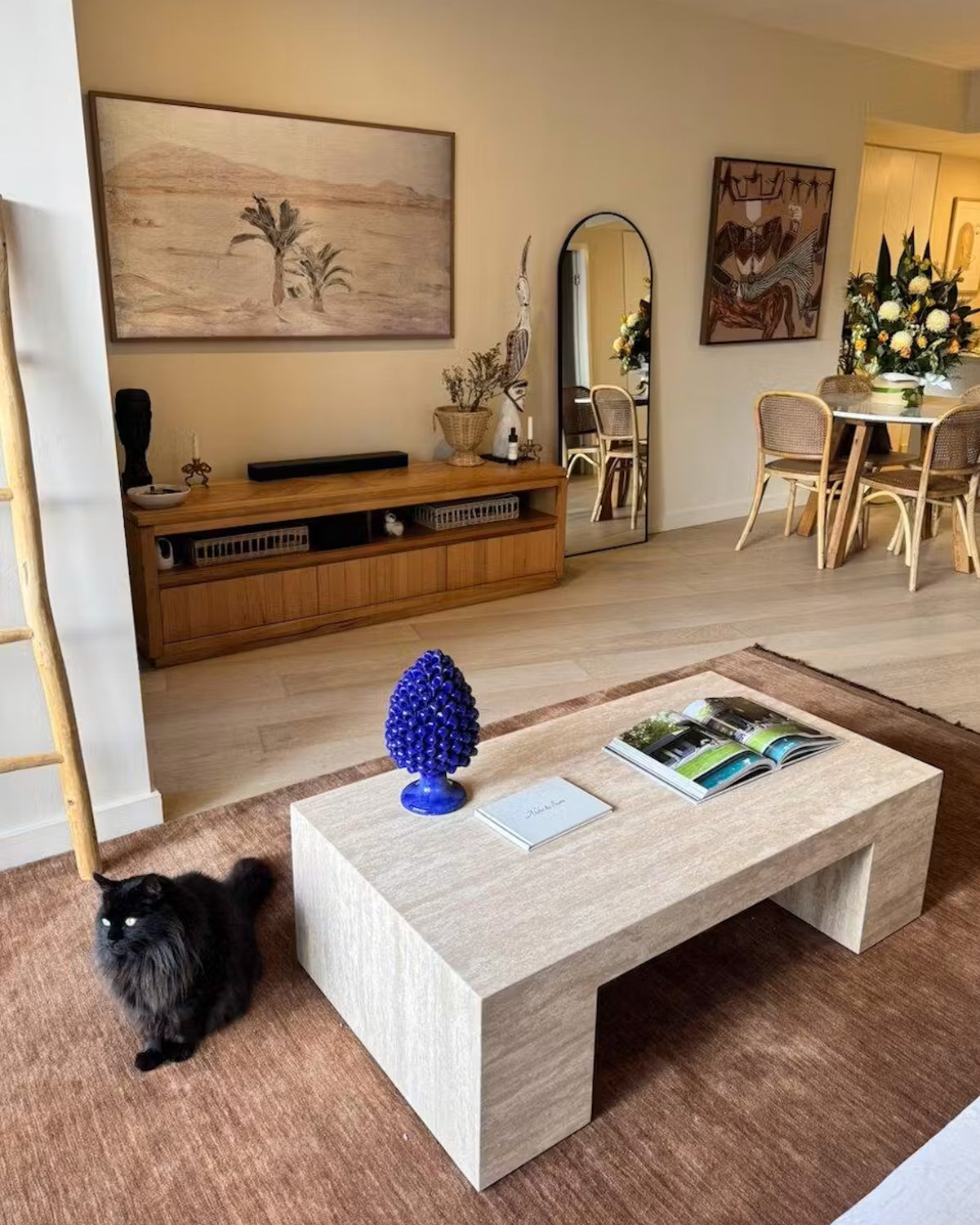Cream travertine coffee table styled in a living room