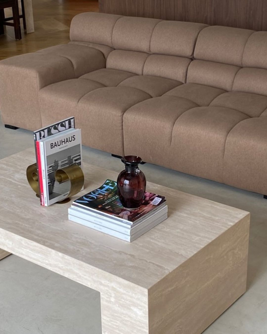 Cream travertine coffee table styled in a living room