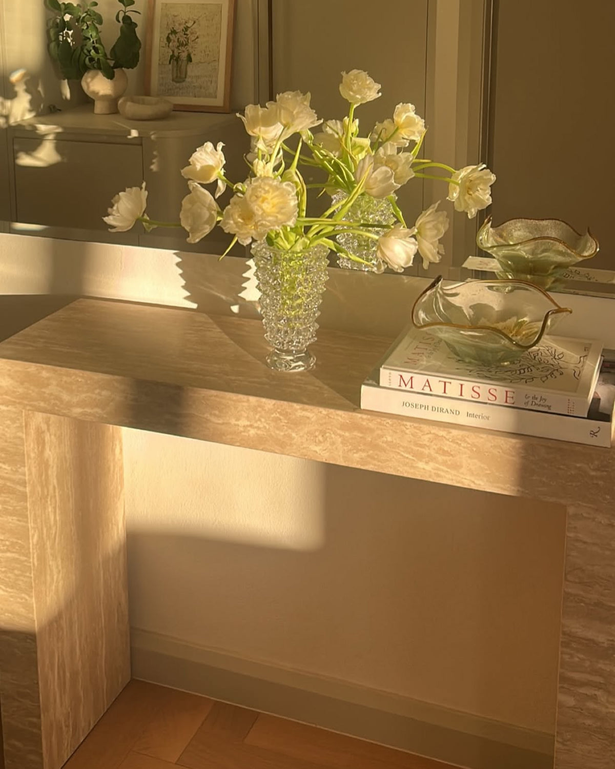Cream travertine console table styled