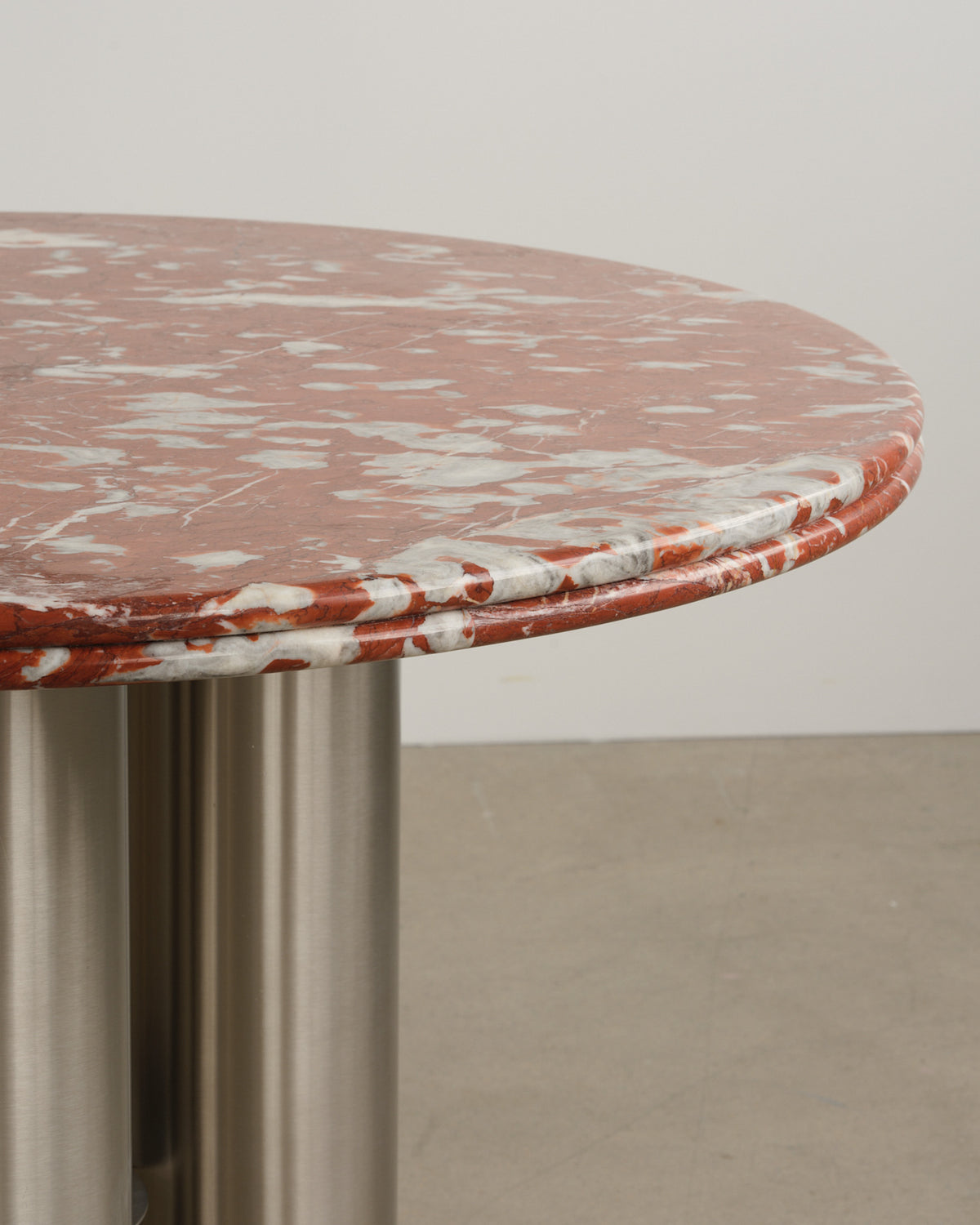 Stainless steel and marble tabletop dining table