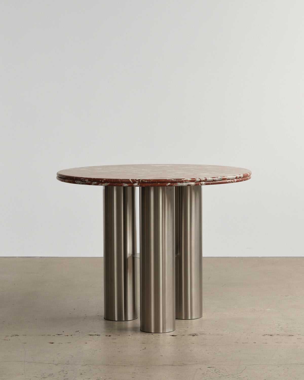 Stainless steel and marble tabletop dining table