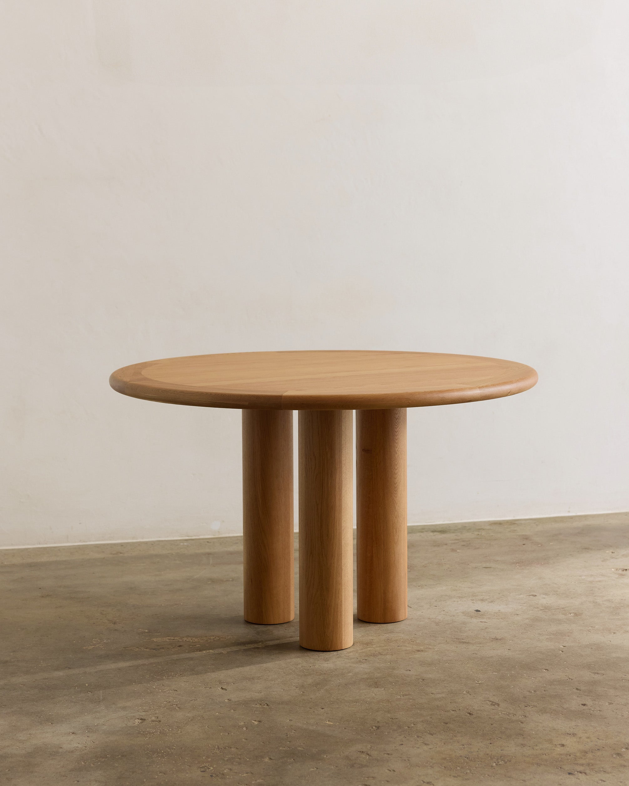 Round oak timber dining table