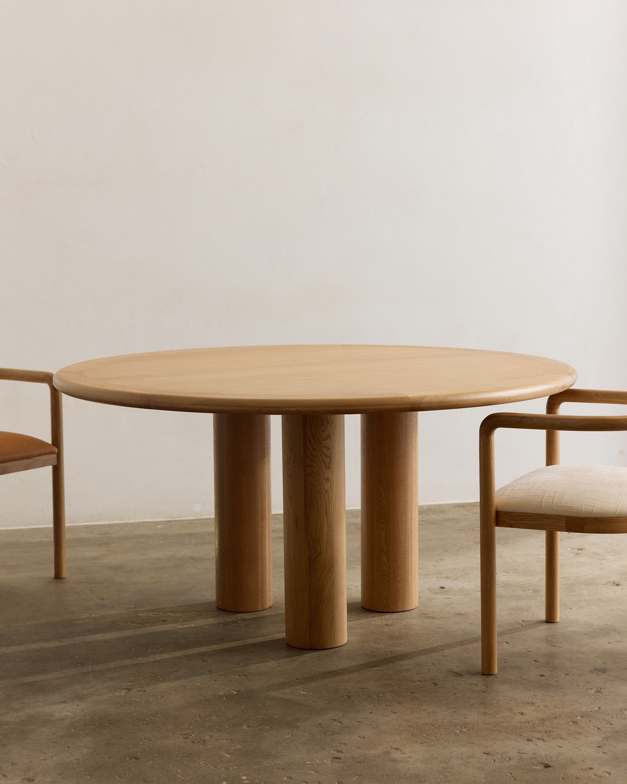 Round oak timber dining table