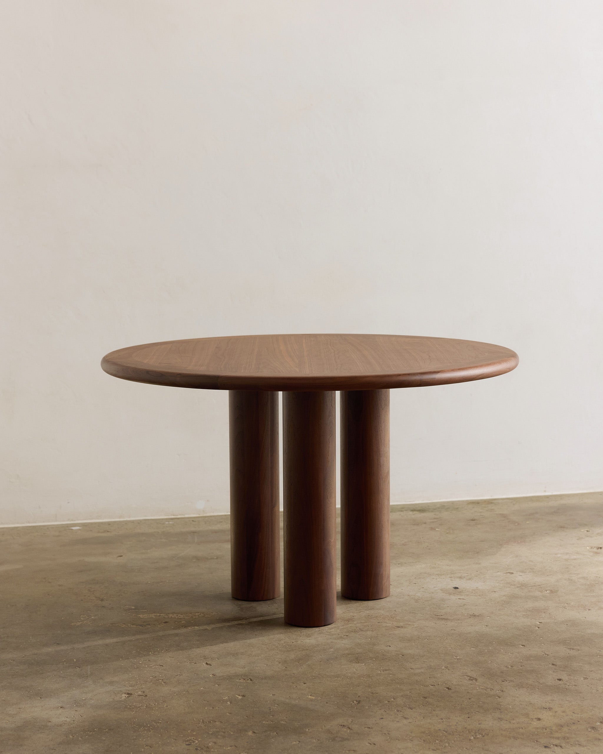 Round walnut timber dining table