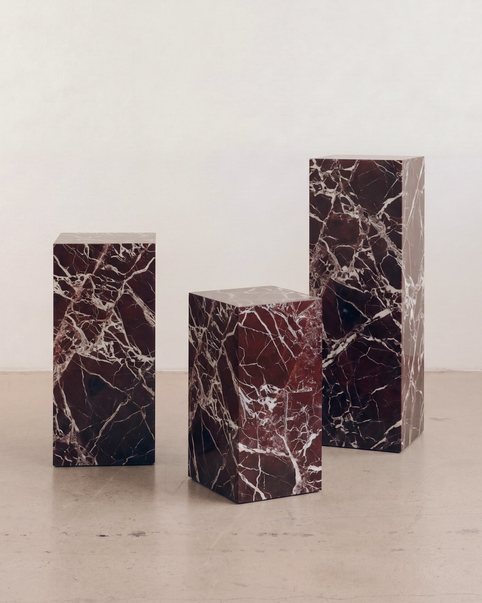 Three rosa levanto plinths