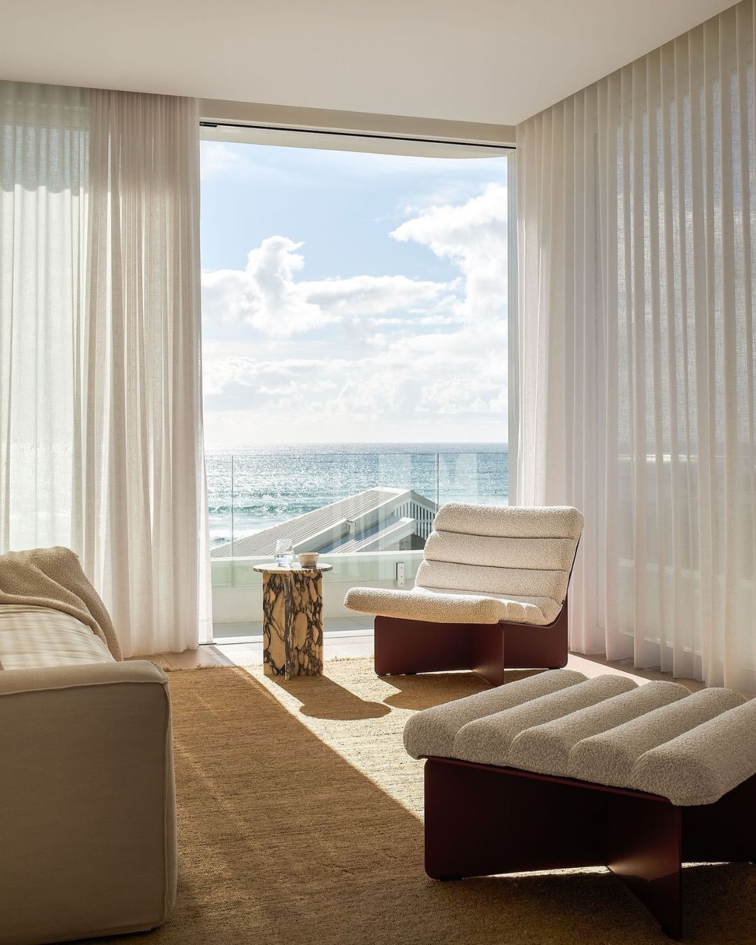 Modern living room with a view of the ocean.