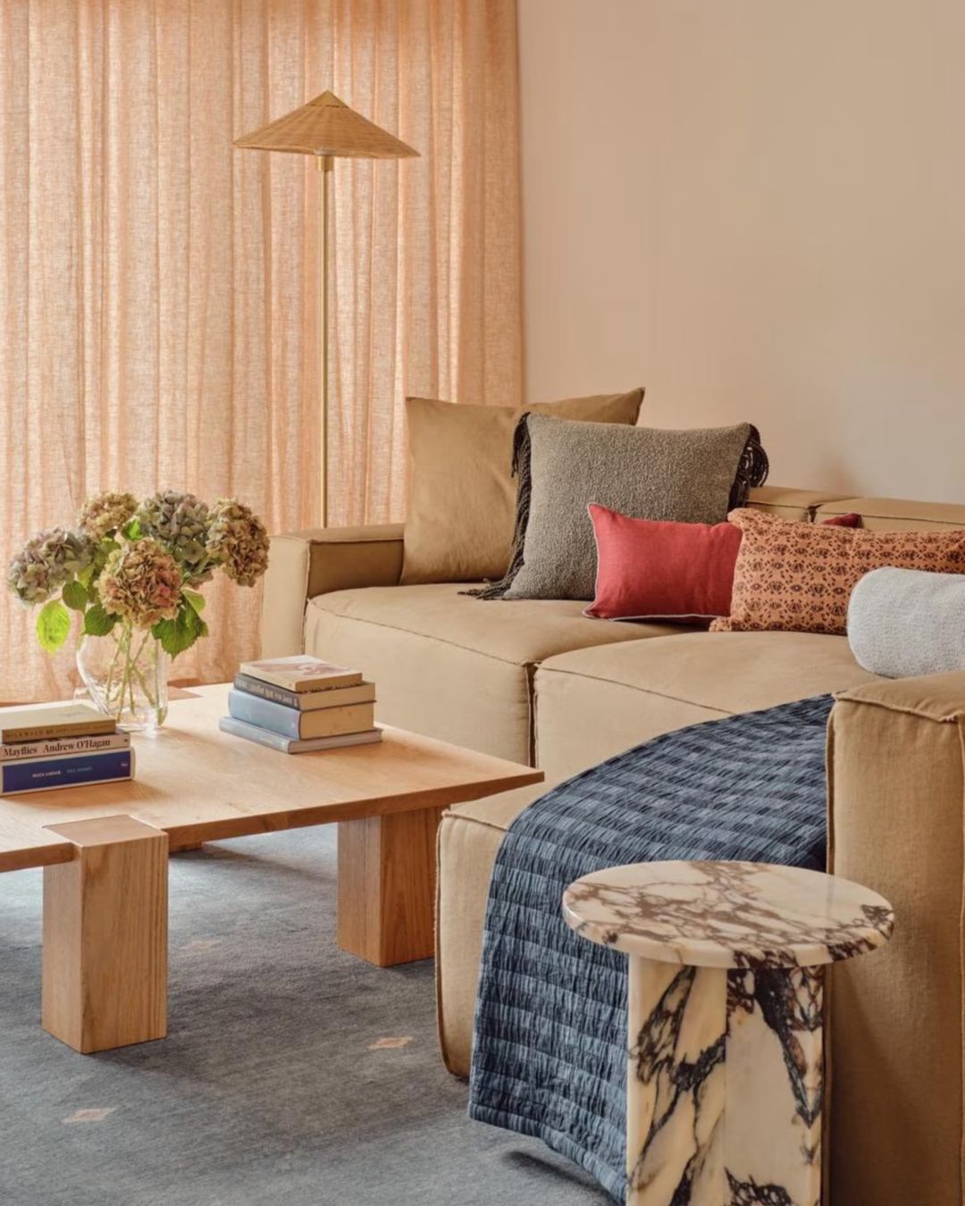 Small calacatta viola side table styled in a living room