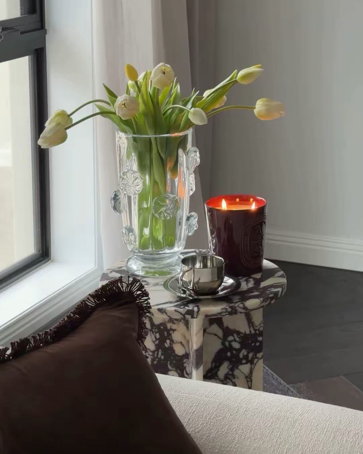 Small calacatta viola side table styled in a living room
