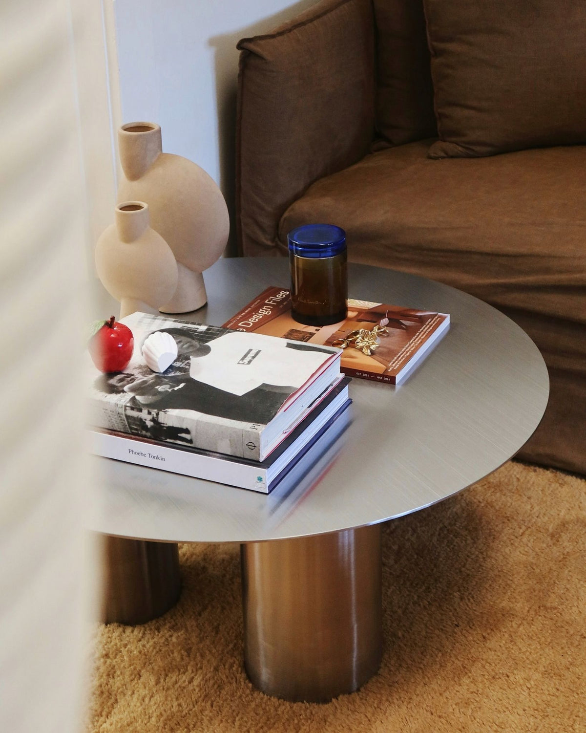 Round coffee table in a living room setting.
