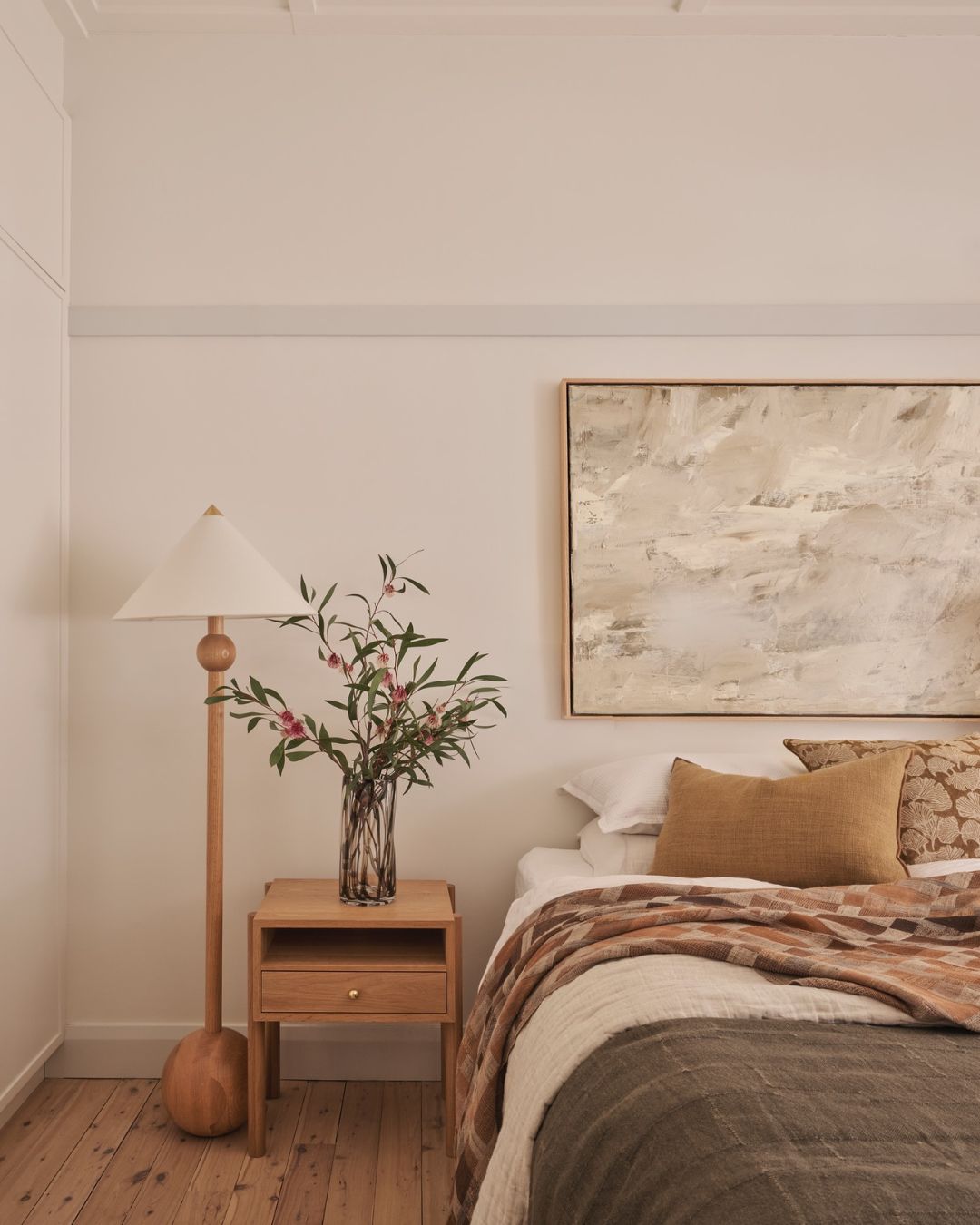 Bedroom with oak wooden nightstand and lamp