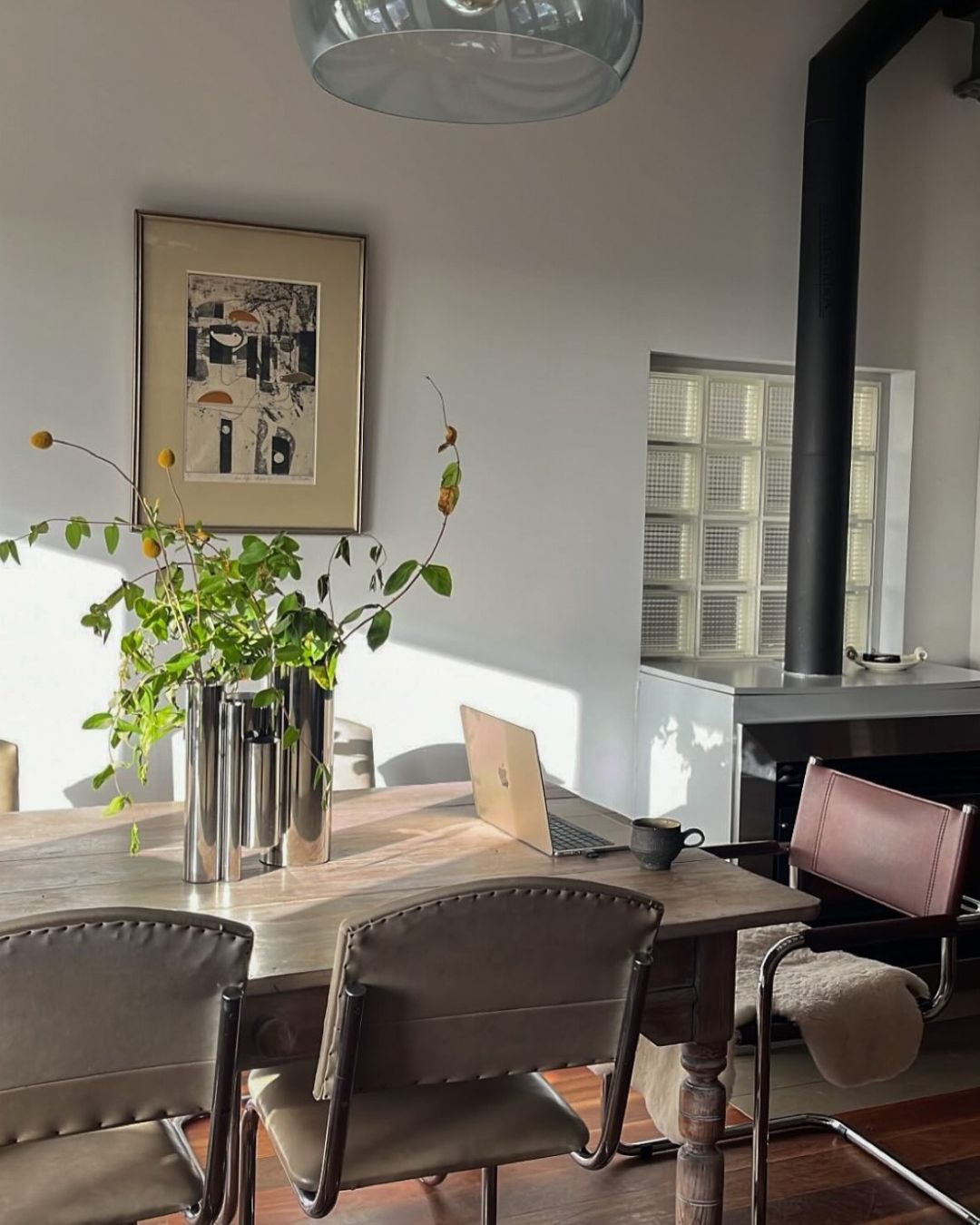Stainless steel vase styled in a dining room