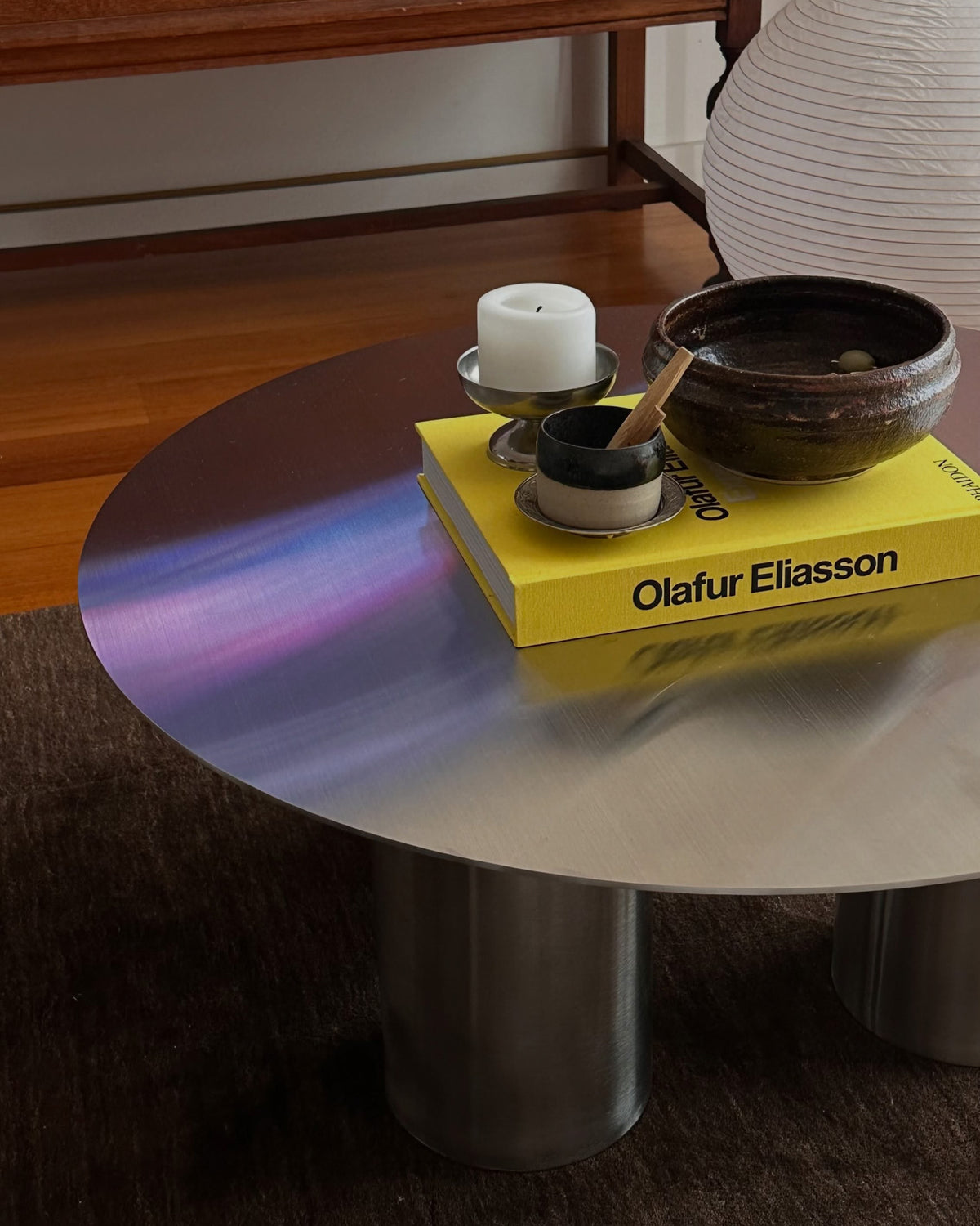 Round stainless steel coffee table styled