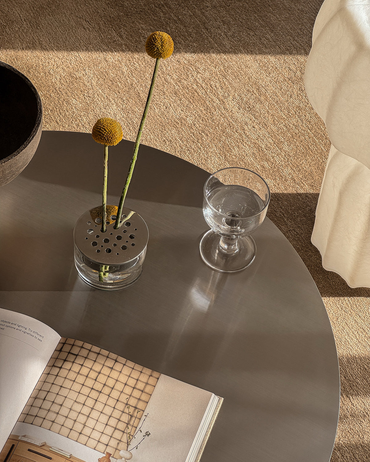 Round stainless steel coffee table styled