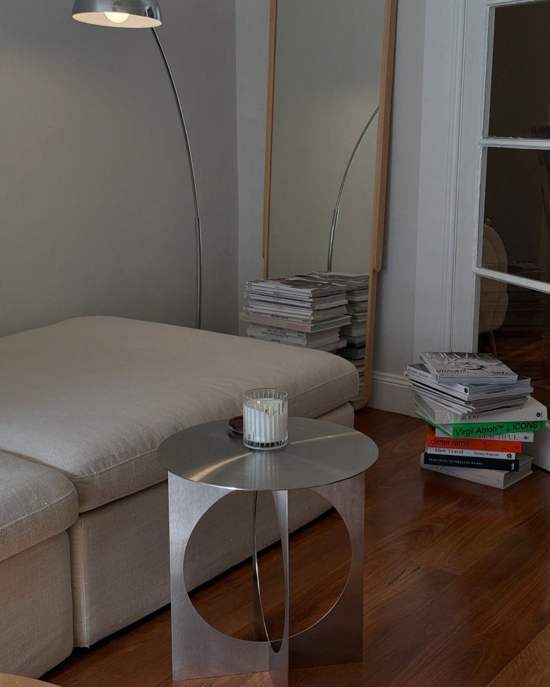 Stainless steel side table styled in a living room