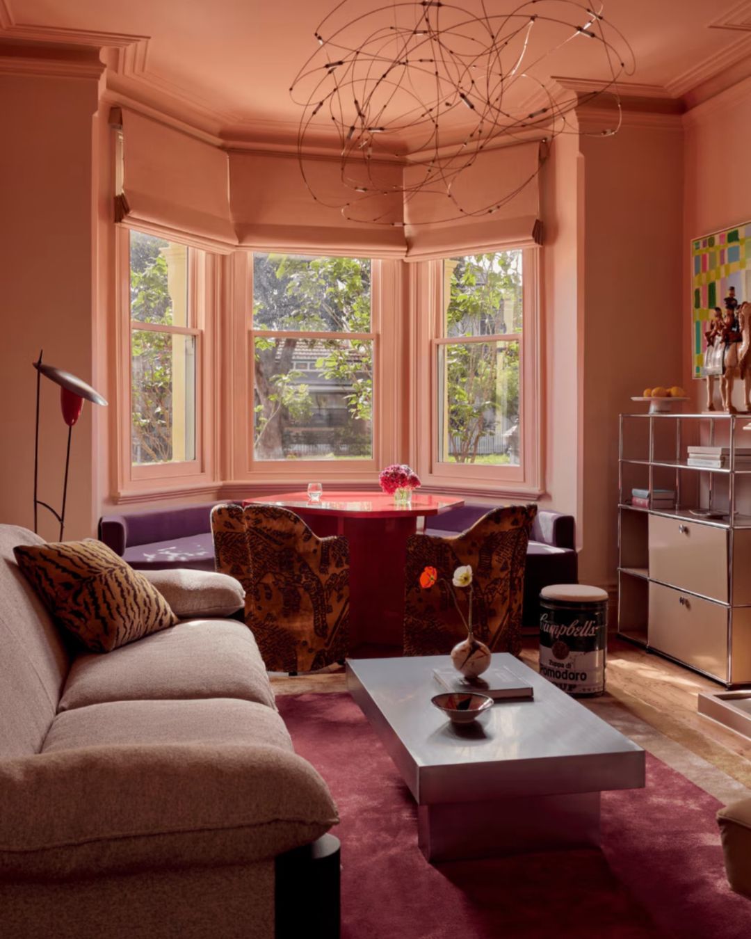 Paris coffee table styled in a colourful red living room