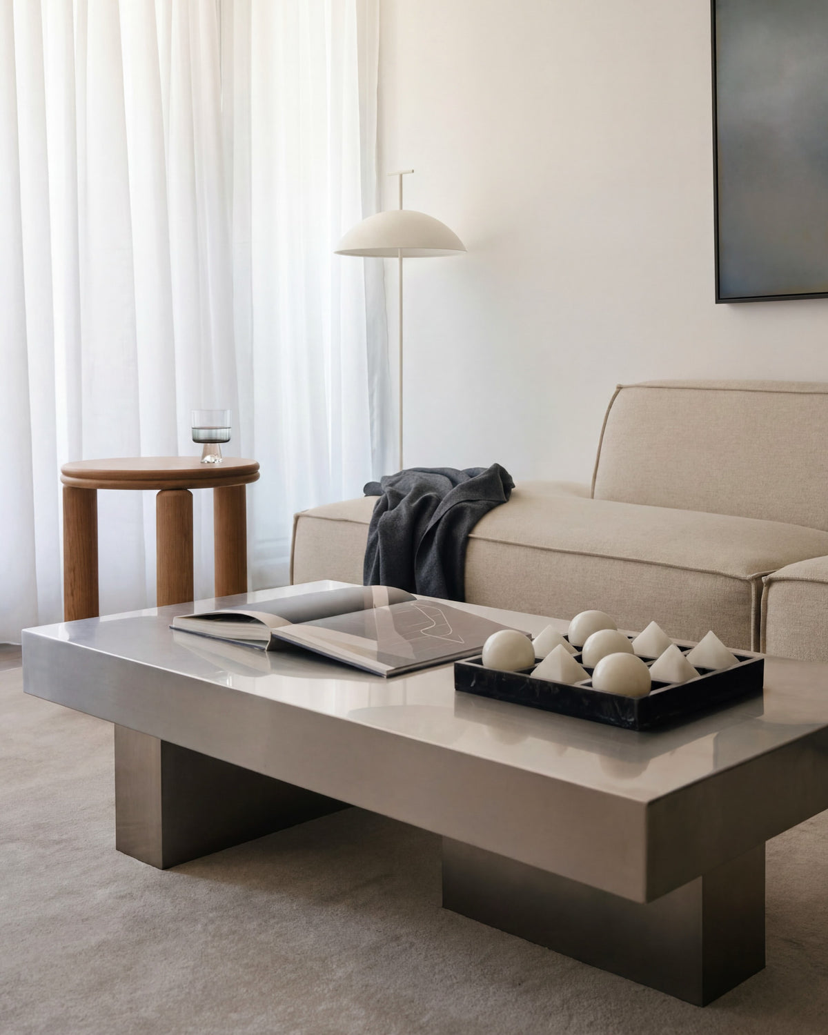 Stainless steel coffee table styled in a living room.