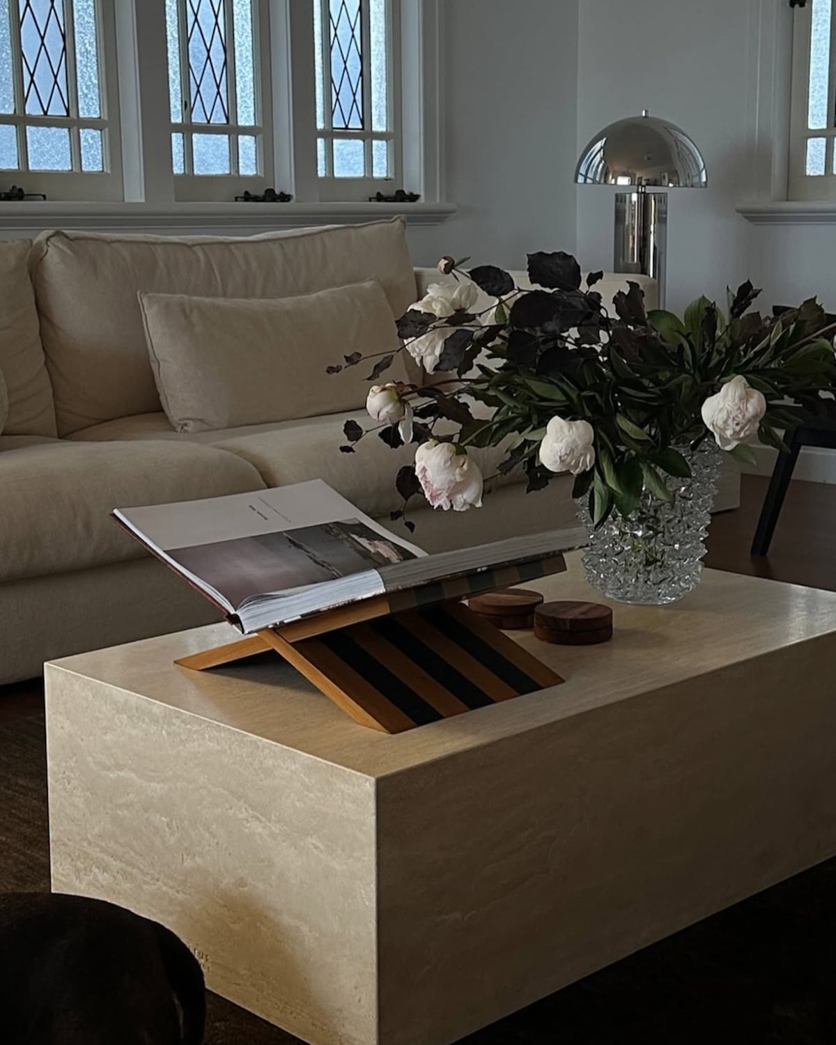 Cream travertine coffee table styled