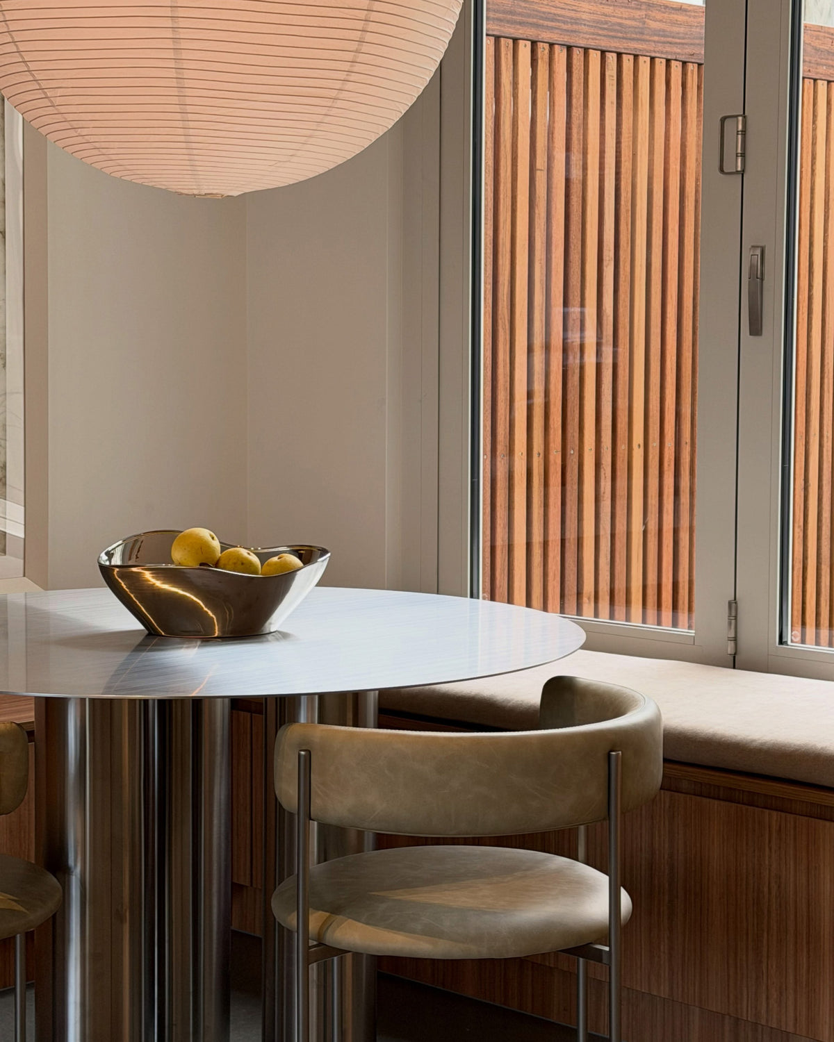 Dining nook with a stainless steel dining table