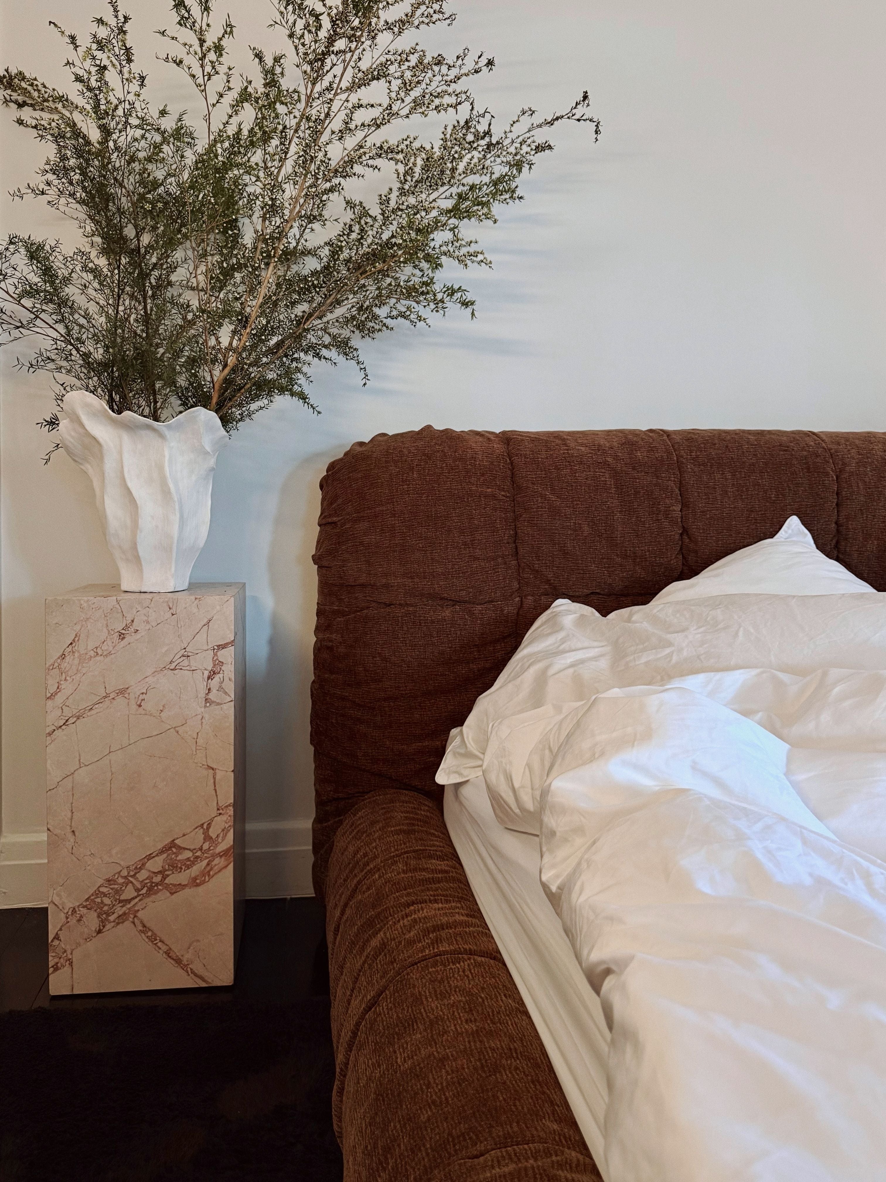 Bedroom styled with marble plinth