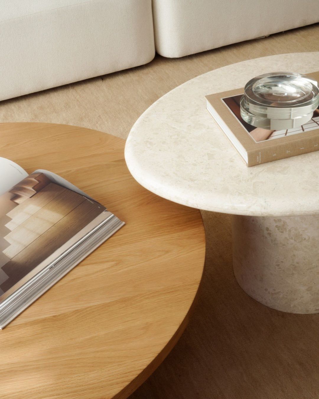 Rounded stone and wood coffee tables