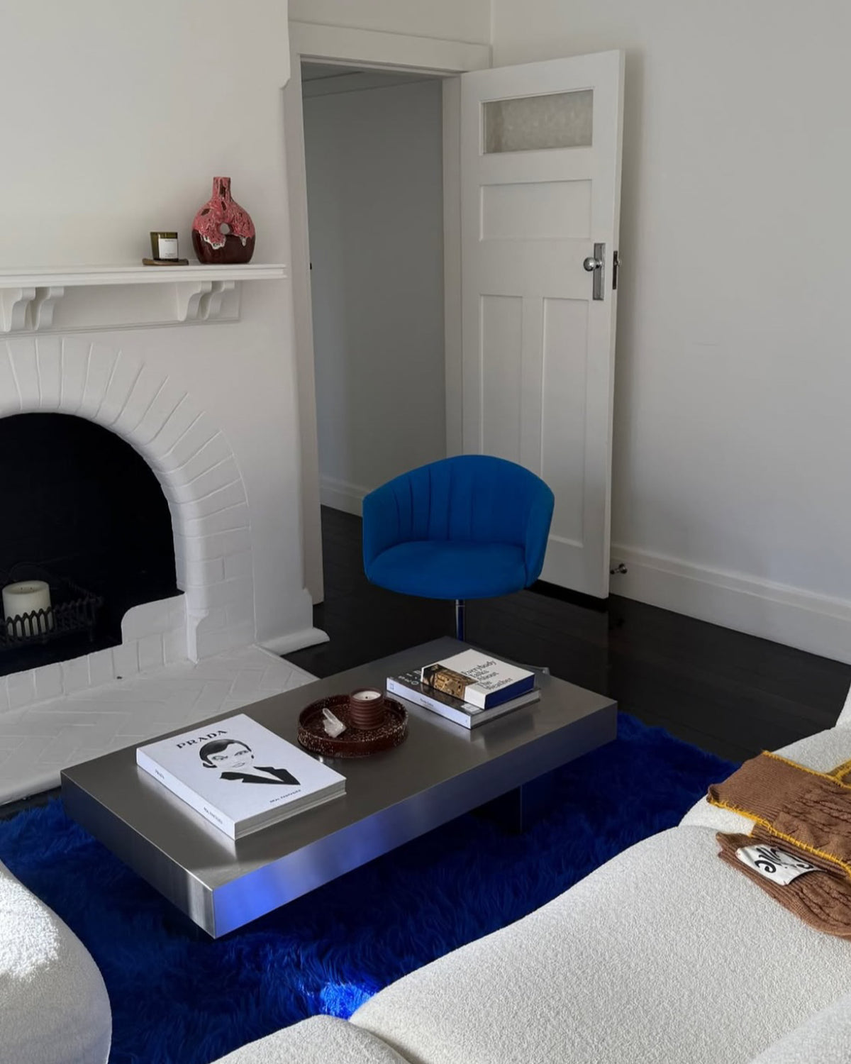 Stainless steel coffee table styled in a living room