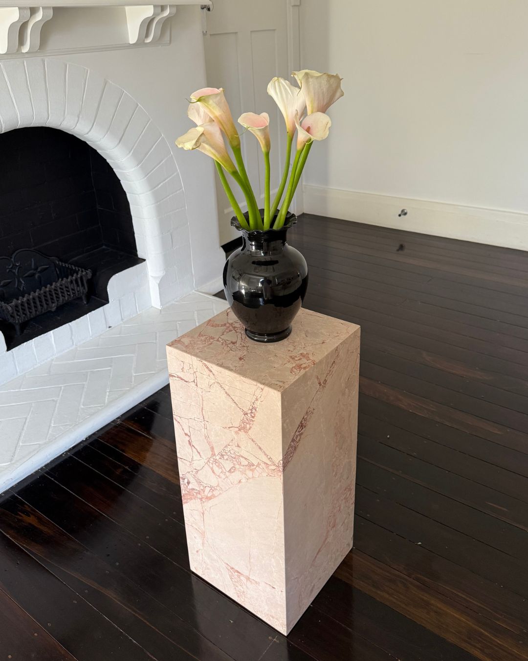 Marble plinth side table styled with flowers