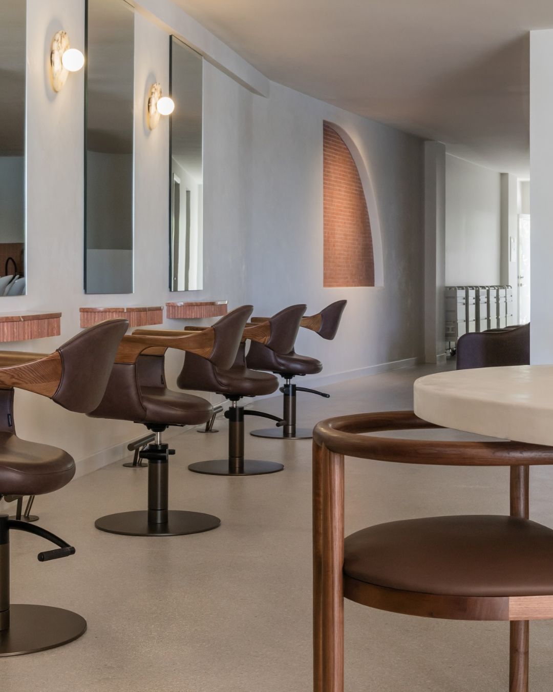Walnut timber dining chair in a salon